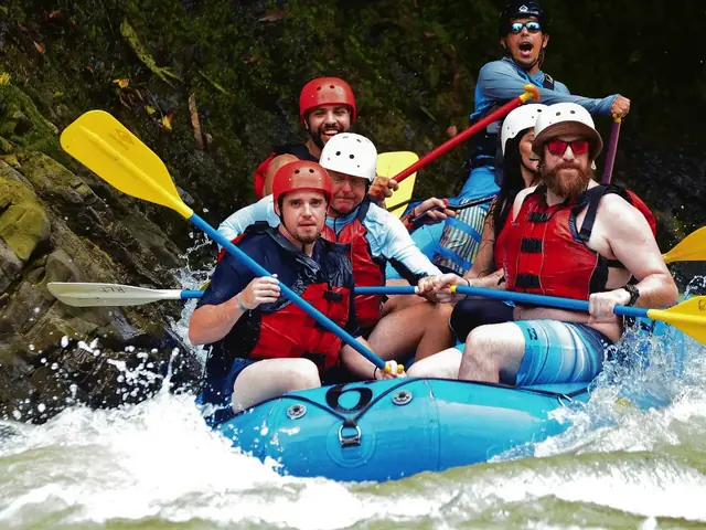 Rafters paddling through white water on the Savegre River